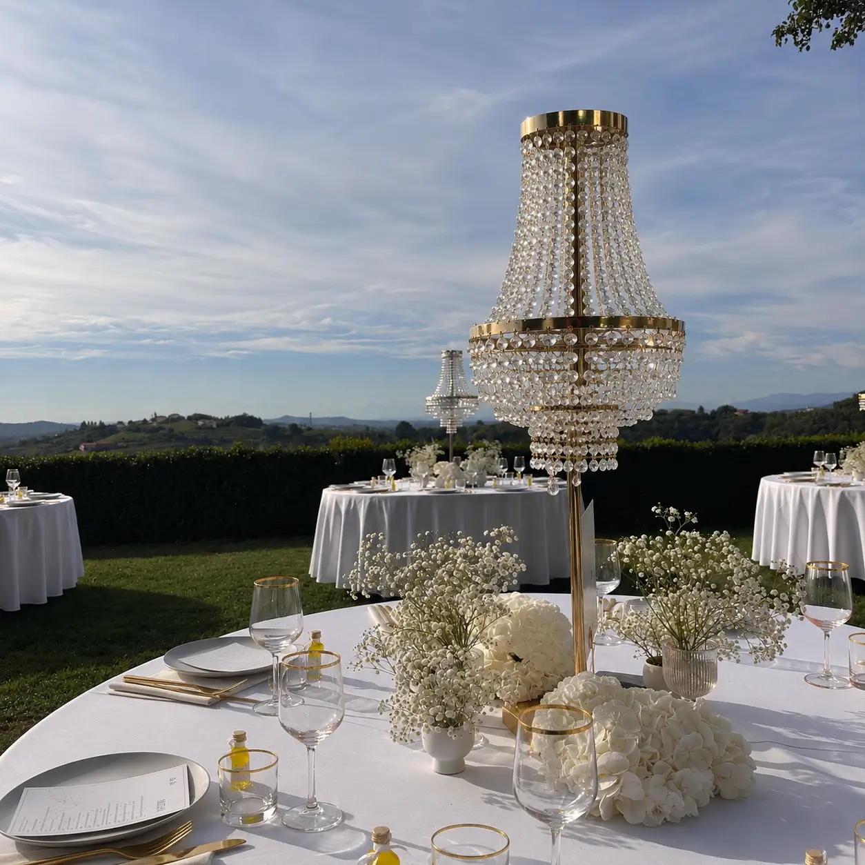 Chandelier Stand Crystal featuring elegant gold chandeliers with cascading crystals and warm lighting on a luxury wedding banquet table.